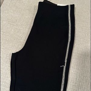 Black with diamonds in the leg. One minor piece off, could be sewn back on!